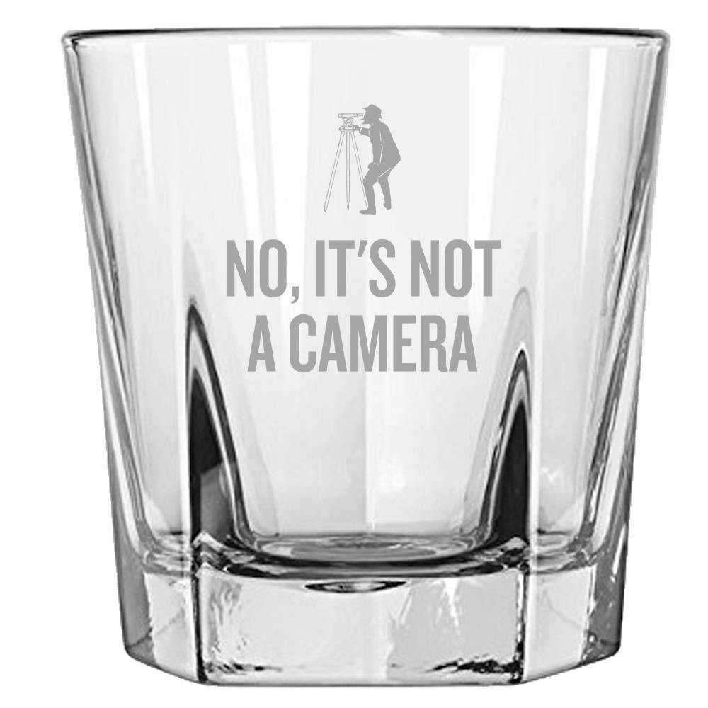 Funny Surveying Gift Surveyor Gift Idea Land Surveyor Gift No It39s Not A Camera Rocks Glass Whiskey Tumbler Graphic Tee – Warm & Stylish · High-Quality Print