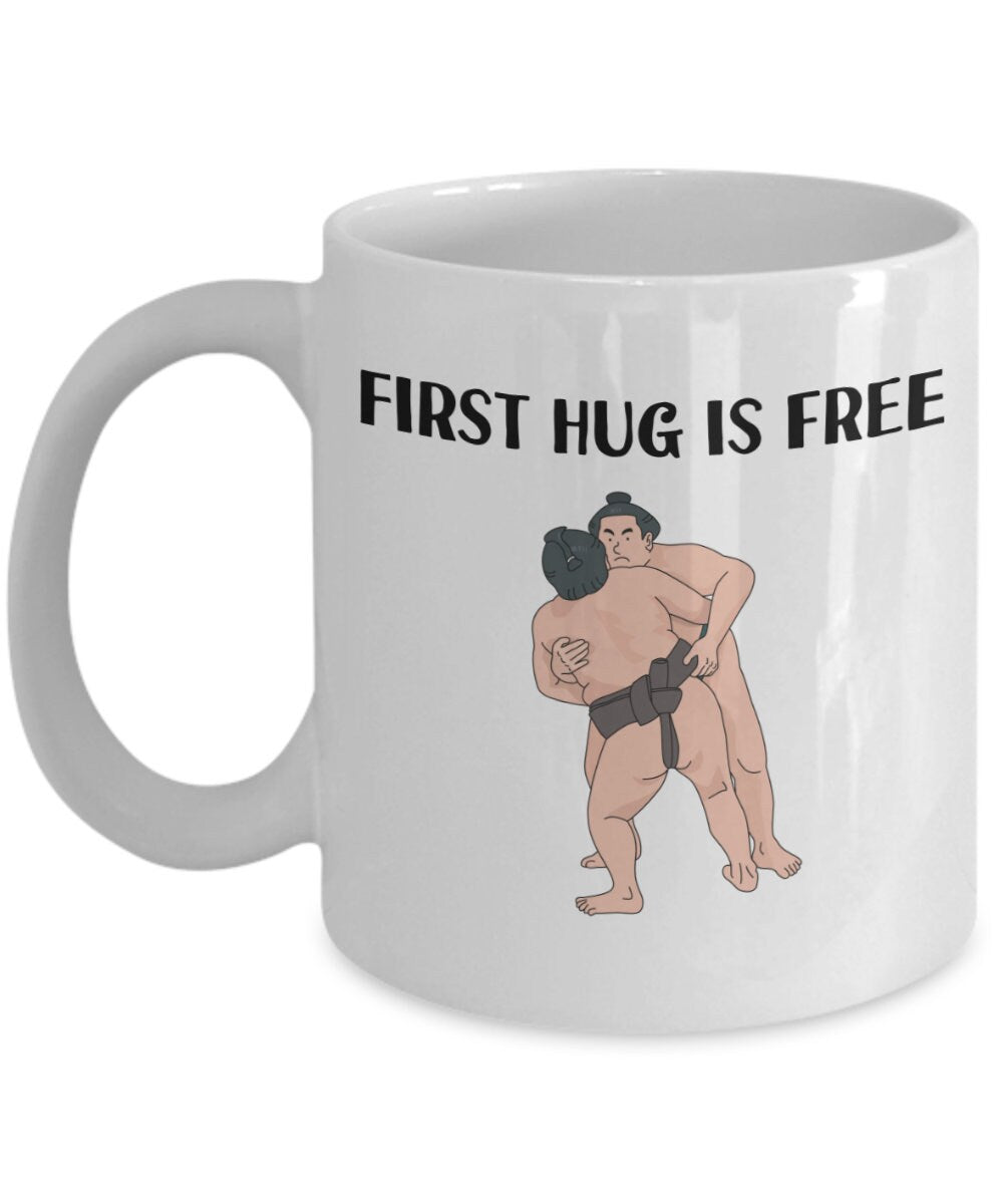 Sumo Gift Sumo Wrestling Mug Sumo Wrestler Gift Funny Sumo Present First Hug Is Free Graphic Tee – Premium Graphic · Trending Graphic Apparel