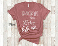 Rockin This Bebe Life Grandma Tshirt Special Grandmother Gift Idea for Mother39s Day Birthday Christmas or Pregnancy Reveal Announcement Graphic Tee – Aesthetic Look · Great Gift For Fans