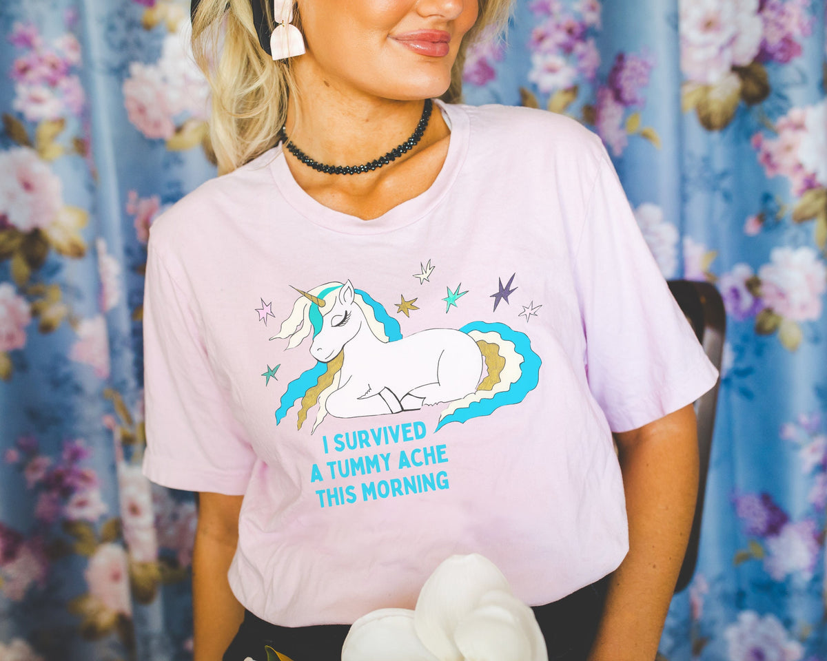 Funny Tummy Ache Survivor Tee Shirt for Friend Who Loves Unicorns and Always Has an Upset Stomach Silly Whimsigoth Unicorn Tee with Stars Graphic Tee – Aesthetic Look · Perfect For Daily Wear