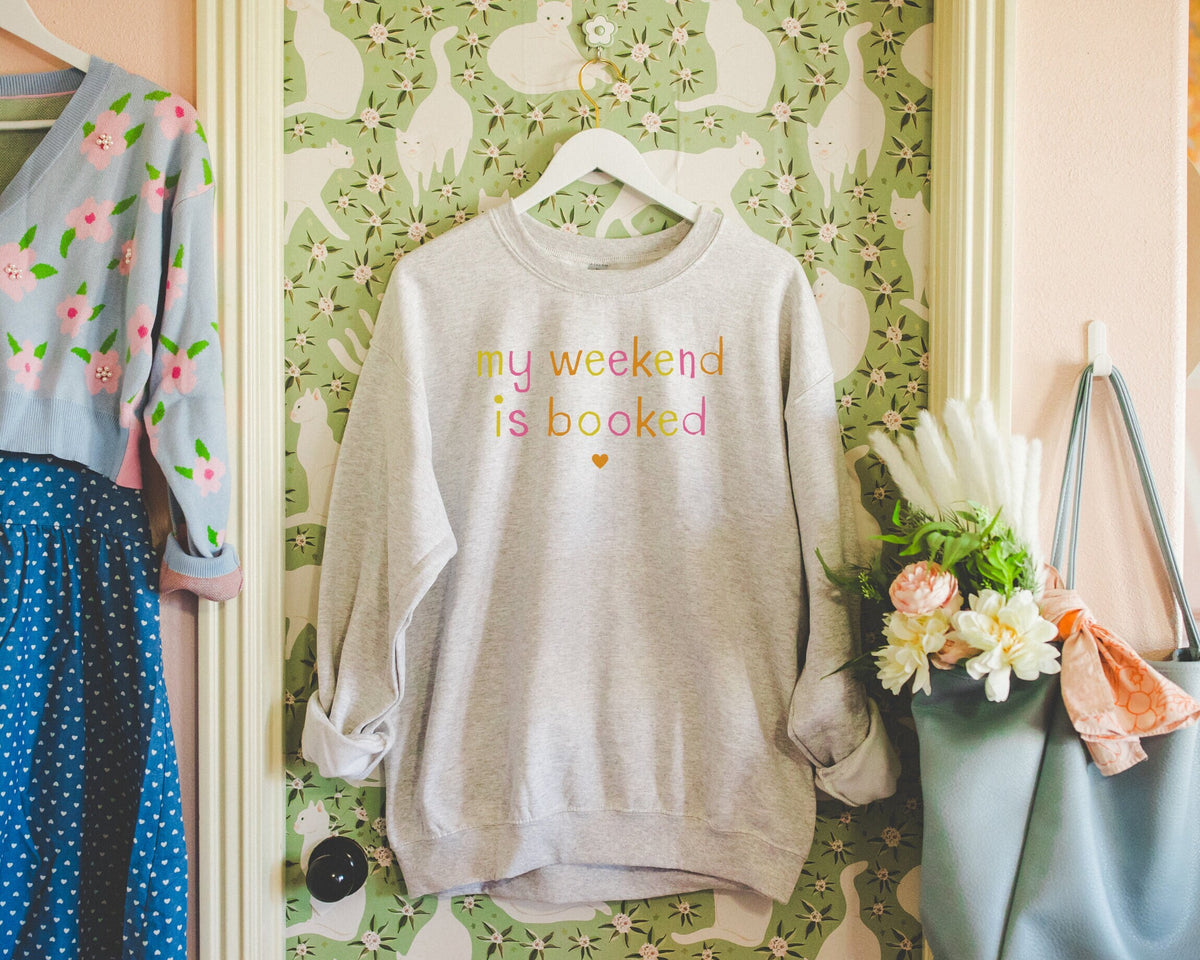 Funny Bookish Gift for Reader My Weekend is Booked Cute Romantasy Reader Sweatshirt for Sister Cute Minimalist Book Lover Gift with Heart Sweatshirt – Bold Style · Must-Have Style
