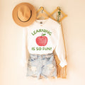 Cute Elementary Teacher Crewneck for Friend Who Teaches Kindergarten or First Grade Learning is So Much Fun Colorful 90s Aesthetic Shirt Graphic Tee – Cozy Vibes · High-Quality Print