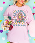 Cute Science Teacher Tee Shirt with Retro Flowers in Outer Space Learning is a Blast Trendy Back To School Elementary School Teacher Shirt Graphic Tee – Warm & Stylish · High-Quality Print