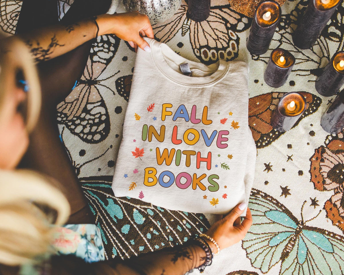 Cute Fall Reading Teacher Sweatshirt Fall in Love With Books Adorable Y2K Aesthetic Bookish Shirt School Librarian First Grade Teacher Sweatshirt – Premium Graphic · High-Quality Print