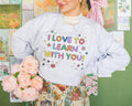 Cute Teacher Sweatshirt with Stars and Adorable Y2K Doodles I Love to Learn With You Colorful Kindergarten or First Grade Teacher Crewneck Sweatshirt – Feel-Good Design · Perfect For Daily Wear