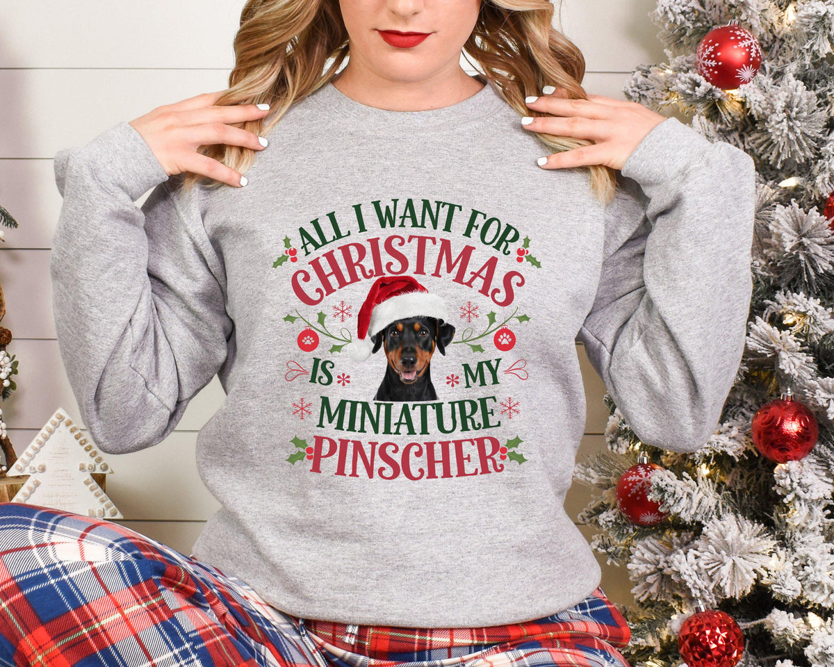 Xmas sweater Christmas Sweatshirt Festive Sweater For Dog Lover All I Want For Christmas Is My Miniature Pinscher Funny Xmas Sweater Sweatshirt – Soft Feel · Trending Graphic Apparel
