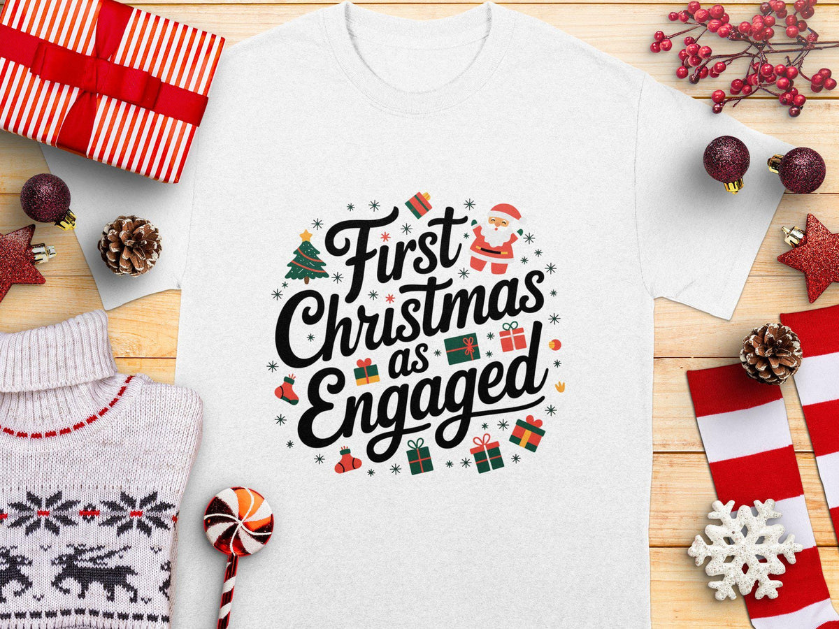 First Christmas as Engaged TShirt Cute Christmas Engagement Shirt Christmas Gift for Engaged Couple Holiday Tee Festive Shirt Graphic Tee – Fan Favorite · High-Quality Print