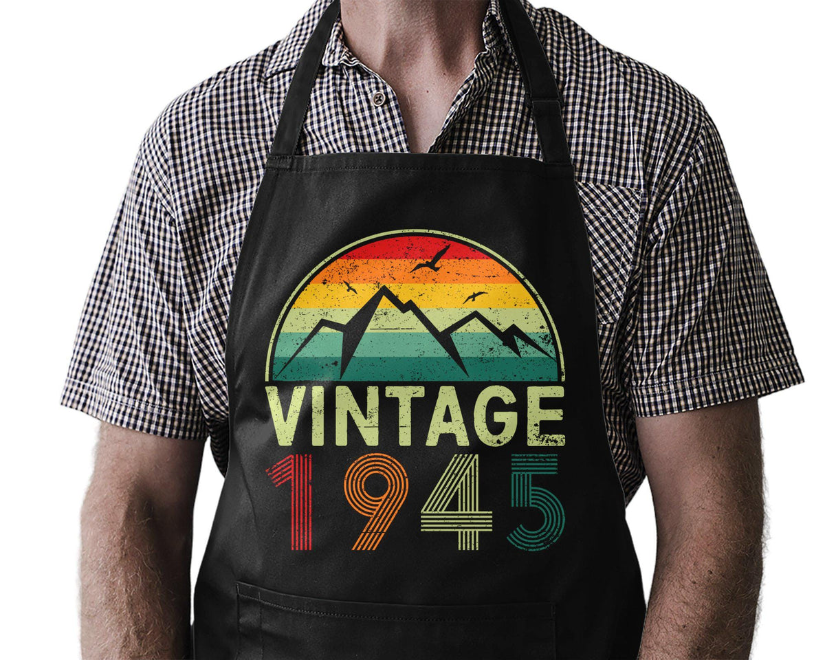 80th Birthday Gift Born 1945 Funny Cooking Apron BBQ Master Grill Pro 80 Years Old Kitchen Legend Gift Him Her Chef Graphic Tee – Aesthetic Look · Trending Graphic Apparel